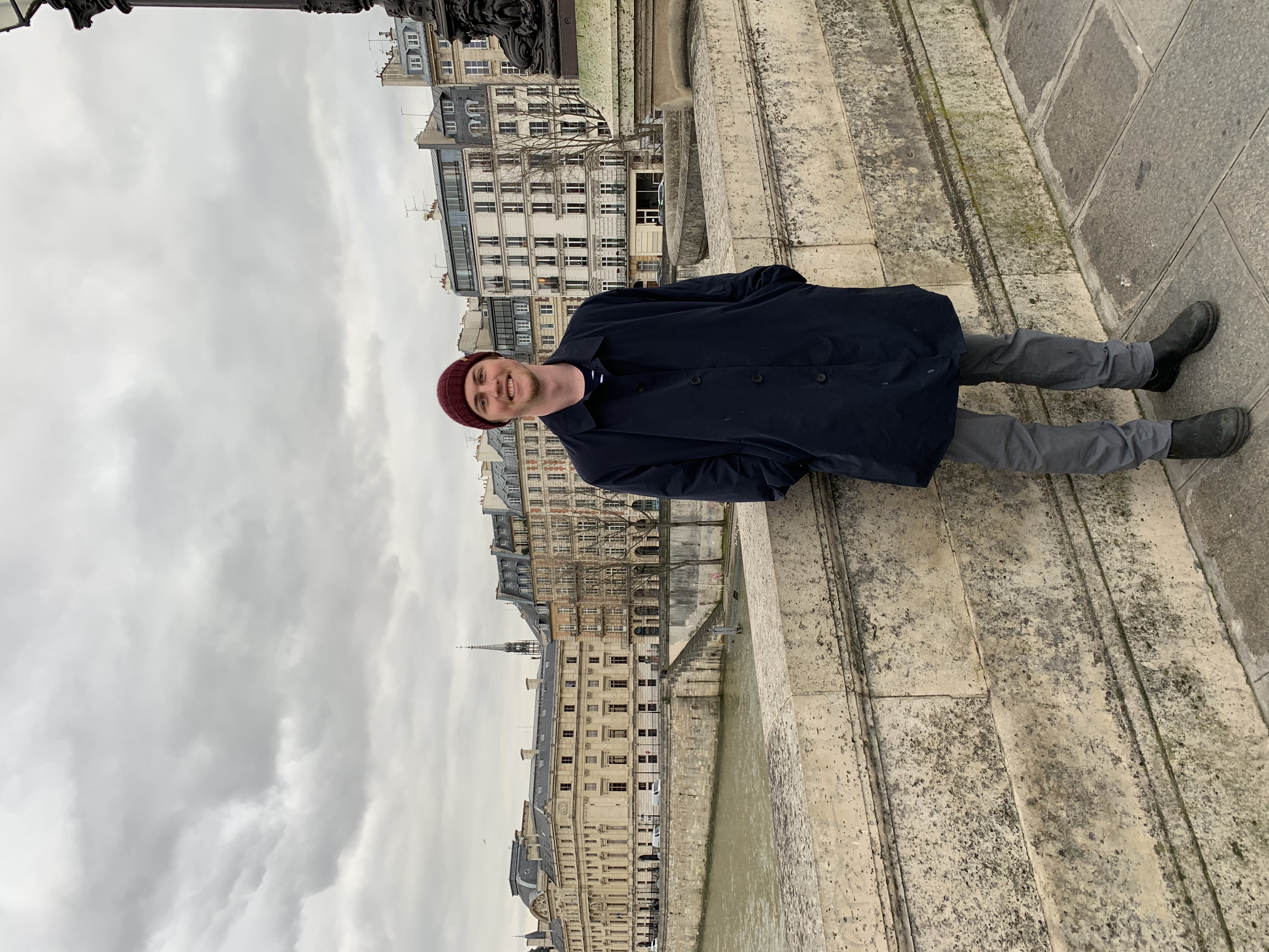standing on a bridge in paris
